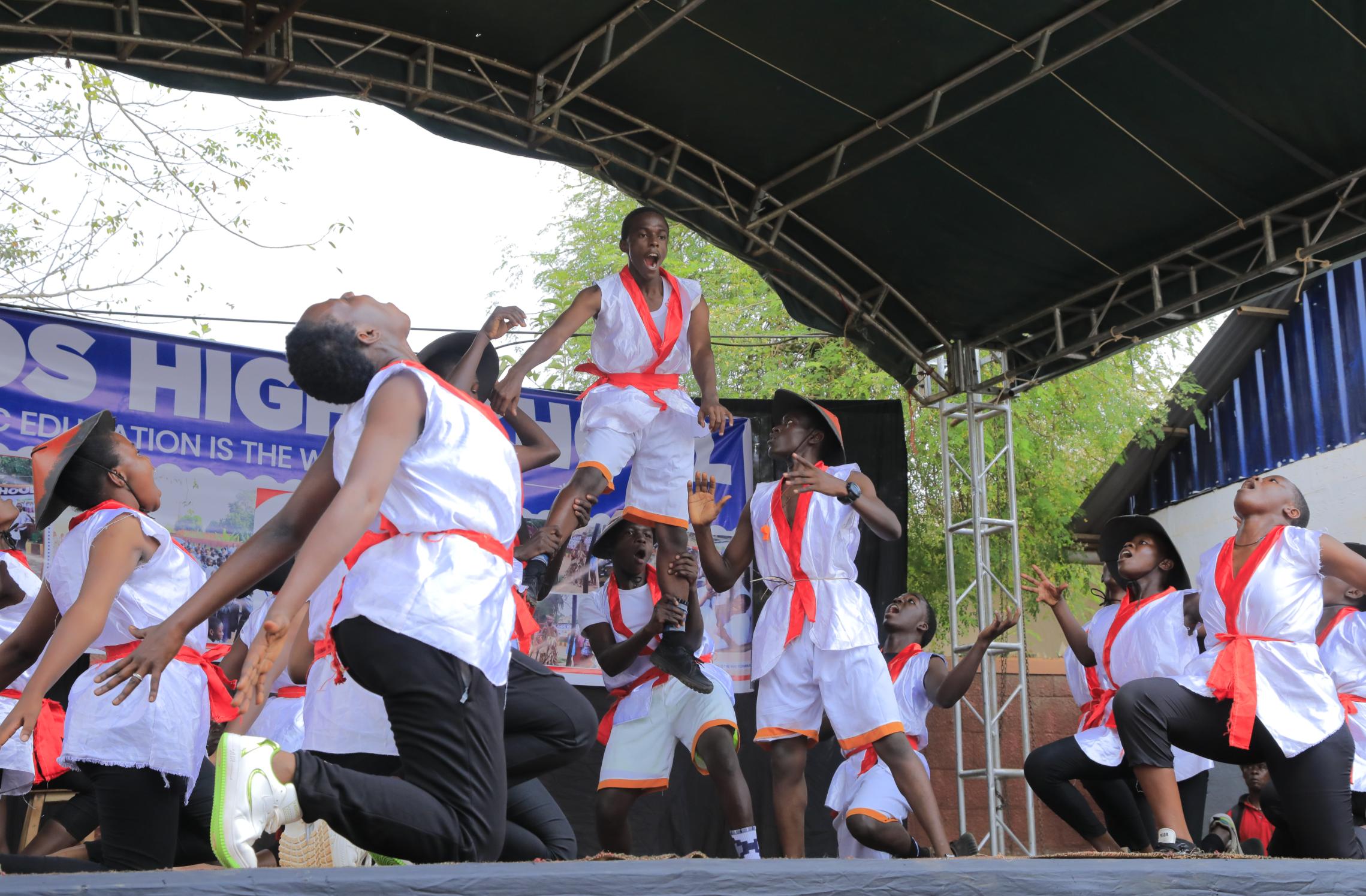 Students performing music, dance and drama